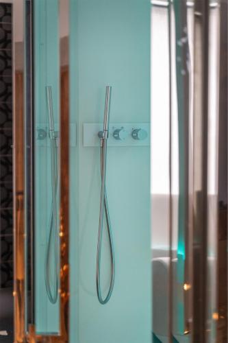 a shower in a bathroom with a glass door at On The Rock in Arco