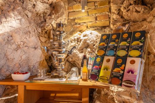 a table with a lamp on top of it at On The Rock in Arco