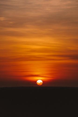 an orange sky with the sun in the horizon at Temple Point Resort in Watamu