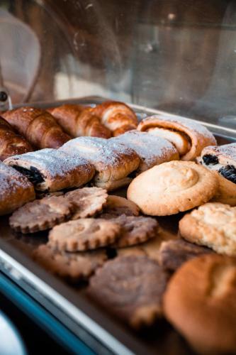 a bunch of different types of pastries and bread at Temple Point Resort in Watamu