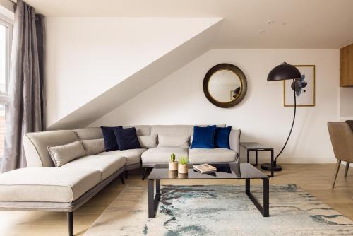 a living room with a couch and a table at Charles Hope Staines Centre in Staines