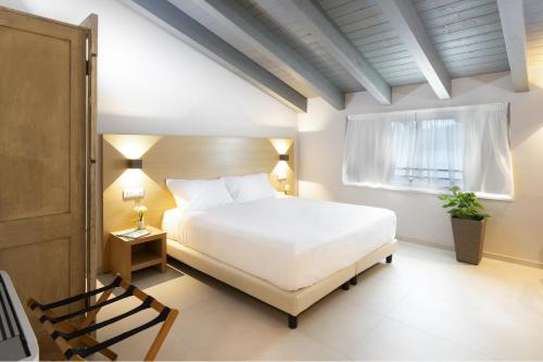 Giường trong phòng chung tại ROS'E MARI GREEN HOME HOTEL.