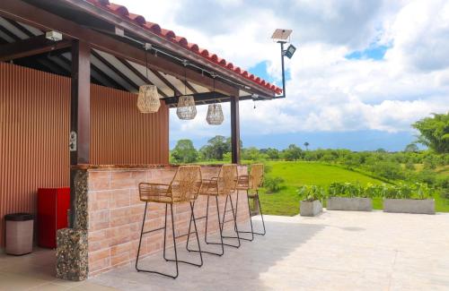 Ein Balkon oder eine Terrasse in der Unterkunft Casa Saman by tesorito fincas exclusivas