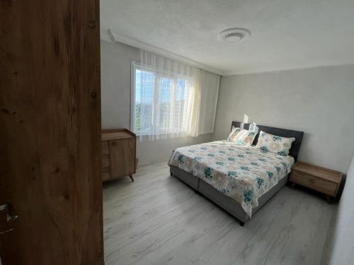 Postel nebo postele na pokoji v ubytování Mutlu Pansiyon