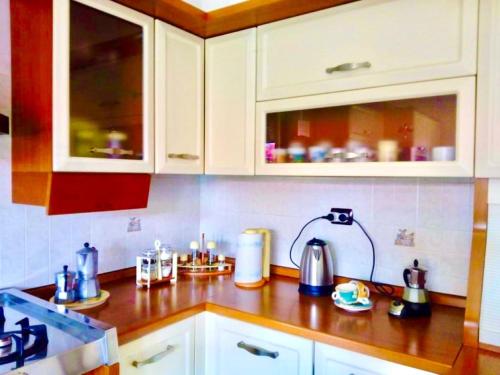A kitchen or kitchenette at Un posto al sole