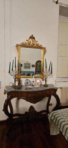 a dressing table with a mirror on top of it at Palazzo Quey in Lecce
