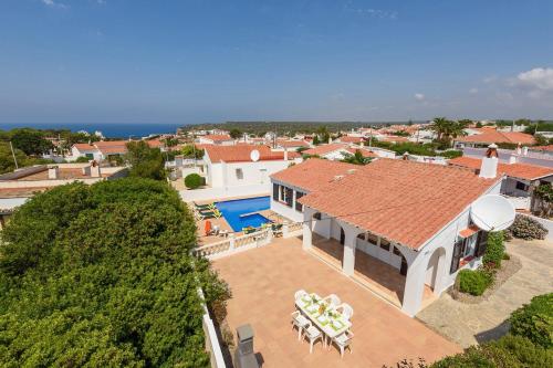 an aerial view of a house with a swimming pool at Villa CLAUDIA Menorca in Cala'n Porter