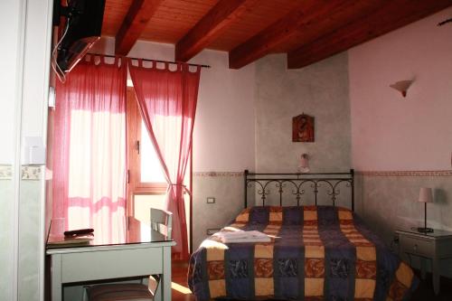 Postel nebo postele na pokoji v ubytování Il Rifugio di Pan