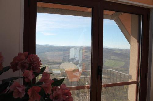 a window with a view of a mountain view at Il Rifugio di Pan in Panni