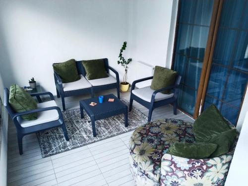 a living room with chairs and a table and a couch at Eryaman, Wide Luxury Concept in Etimesut