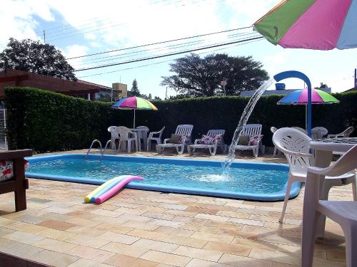 Bazén v ubytování Dom Pedrito Apart Hotel nebo v jeho okolí