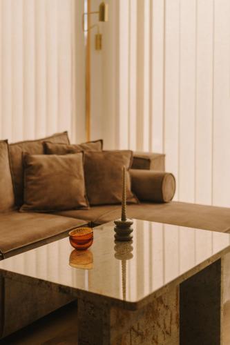 a coffee table in a living room with a couch at Boho Sfera in Kopalino
