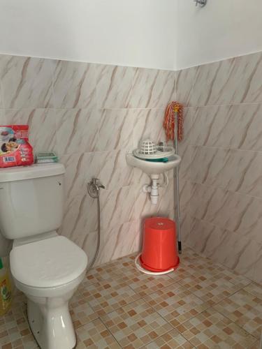 a bathroom with a toilet and a sink at Homestay muslim adawiyah Nilai in Nilai