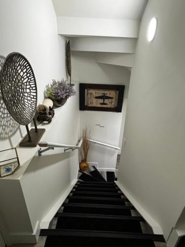 a stairway with a black and white staircase at Cozy Haven! in Edmonton