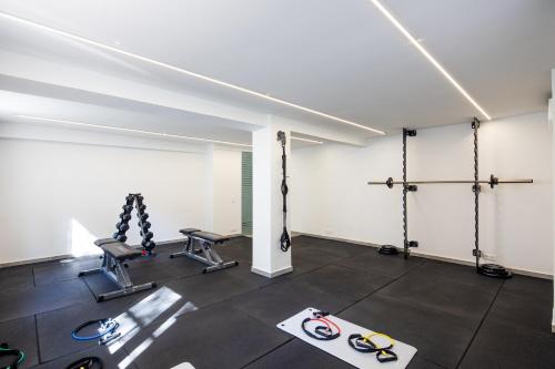 an empty room with a gym with exercise equipment at Athens Sea Side Escape in Vari