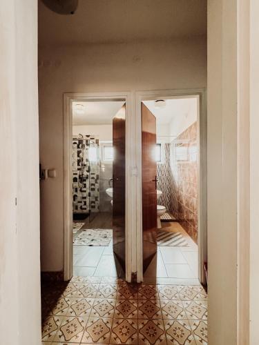 a hallway with a door leading to a wine cellar at Elena Apartment- Spacious for 6, 2 Bathrooms, Free Parking in Rovinj