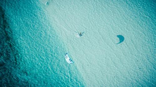 an aerial view of a boat on a beach at Temple Point Resort in Watamu