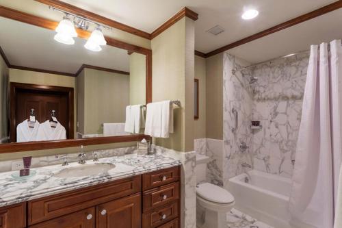 a bathroom with a tub and a sink and a shower at The Ritz-Carlton Club, 3 Bedroom WR Residence 2310, Ski-in & Ski-out Resort in Aspen Highlands in Aspen