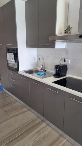 a kitchen with a sink and a counter top at Villa Ocean View of Kali - Erste Meerreihe mit Pool in Kali