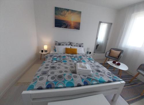 a bedroom with a large bed in a room at Studio M in Pula