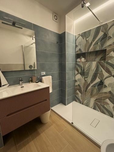 a bathroom with a sink and a shower at Memo - Mediterranean Emotions in San Vito lo Capo