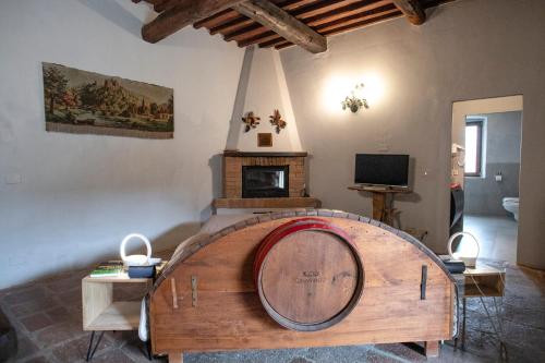 a room with a large wooden barrel in a room at Borgo Casa al Vento in Gaiole in Chianti