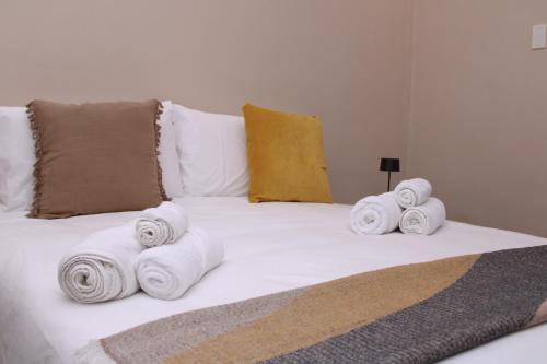 a pile of towels sitting on top of a bed at JOHN'S ROOMS in Villa D'agri