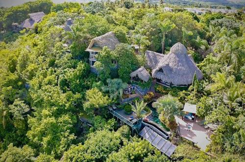 an aerial view of a house with thatched roofs at Casa El Paraiso, Eco Lodge in Santa Bárbara de Samaná