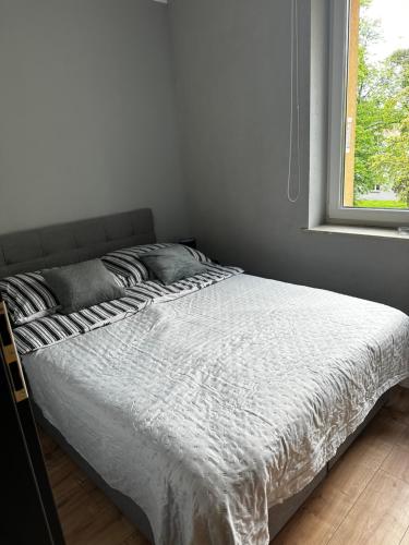 Un pat sau paturi într-o cameră la Apartament Helenka