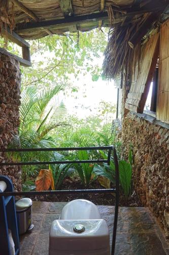 a outside view of a bathroom with a toilet at Casa El Paraiso, Eco Lodge in Santa Bárbara de Samaná