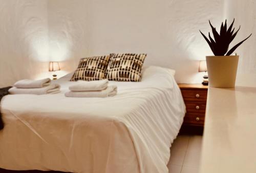 Postel nebo postele na pokoji v ubytování Un Mar Azul que Brilla