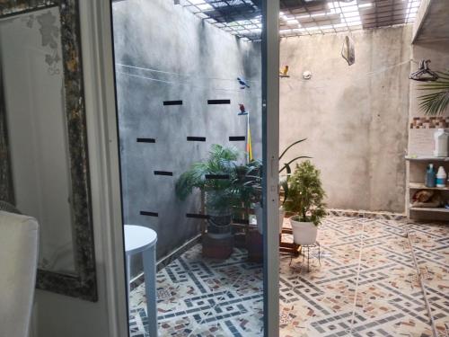 a room with potted plants on a tile floor at 3 NOCHES MINIMAS ESTADIA APARTAMENTO 4 PERSONAS AIRE ACONDICIONADO-buena ubicación in Valledupar