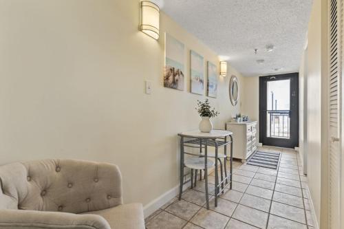 a living room with a couch and a table at Beautiful 2 Bedroom Apartment in Cherry Grove with Stunning Views Buena Vista 402 in Myrtle Beach