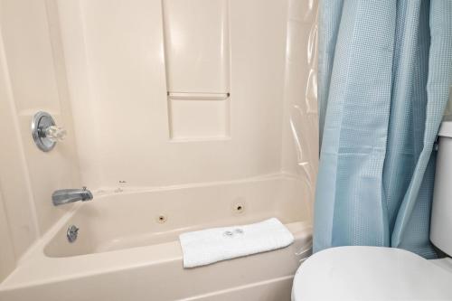 a bathroom with a toilet and a tub and a sink at Beautiful 2 Bedroom Apartment in Cherry Grove with Stunning Views Buena Vista 402 in Myrtle Beach
