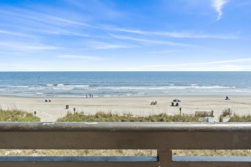 a view of a beach with people on the sand at Beautiful 2 Bedroom Apartment in Cherry Grove with Stunning Views Buena Vista 402 in Myrtle Beach