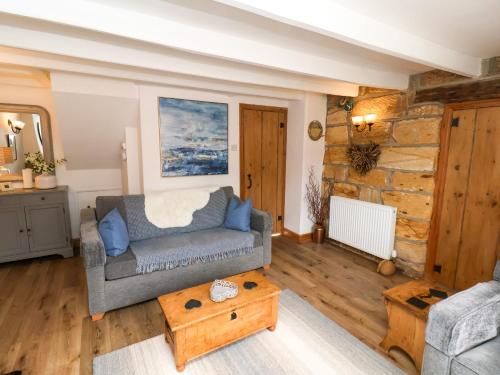 Posezení v ubytování The Cottage