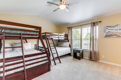 a bedroom with two bunk beds and a window at Pool and Lake Access Lovely Monkey Island Getaway in Afton