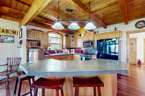 a large kitchen with a large island in the middle at Texas Hideaway in Whitney