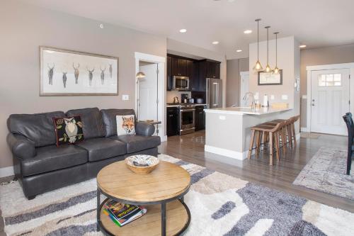 a living room with a couch and a table at Rendezvous 47 Lookout Point in Fraser