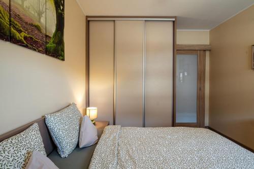 Ein Bett oder Betten in einem Zimmer der Unterkunft Apartamenty u Romy - Mocha