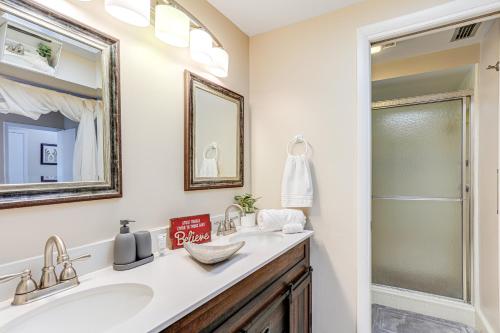 a bathroom with a sink and a mirror at Sunny Port St Lucie Home Lanai and Golf Course View in Port Saint Lucie