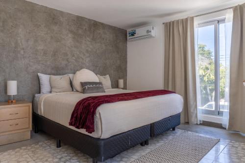 a bedroom with a large bed and a window at CASa SENECA in La Paz