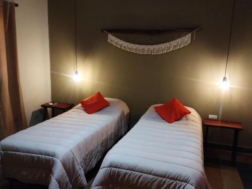 A bed or beds in a room at La Genoveva Posada entre Viñedos