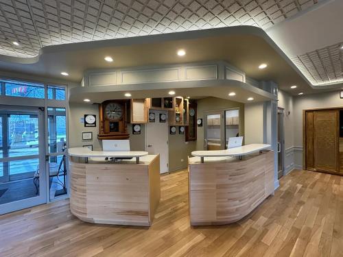 an office with a counter with a clock on the wall at The GEM Museum Suites in Evanston