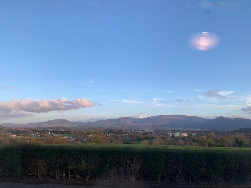 a view of a city with mountains in the distance at Town View in Killarney