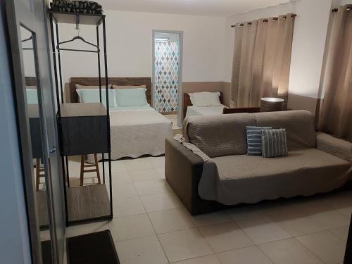 Postel nebo postele na pokoji v ubytování Loft no Recreio