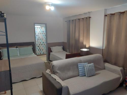 Postel nebo postele na pokoji v ubytování Loft no Recreio