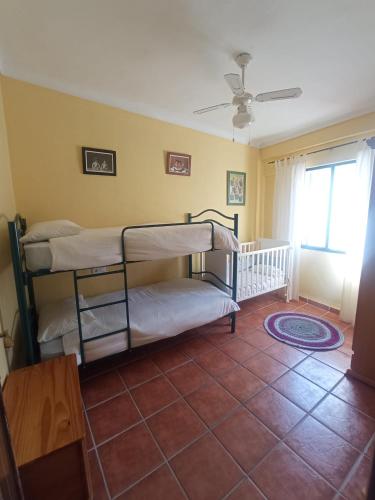 a room with two bunk beds and a window at Hostal R-Conecta in Cuevas de San Marcos