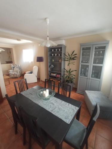 a living room with a table and a couch at Hostal R-Conecta in Cuevas de San Marcos