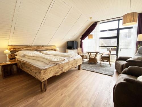 Ένα ή περισσότερα κρεβάτια σε δωμάτιο στο Ferien im Wangerland - Haus Wiesenweg - Apartment 3 1OG